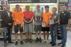 Mill Creek Employees holding paint
