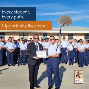 Air Force JROTC Cadet Sophia Nabiev receives an award while other cadets look on