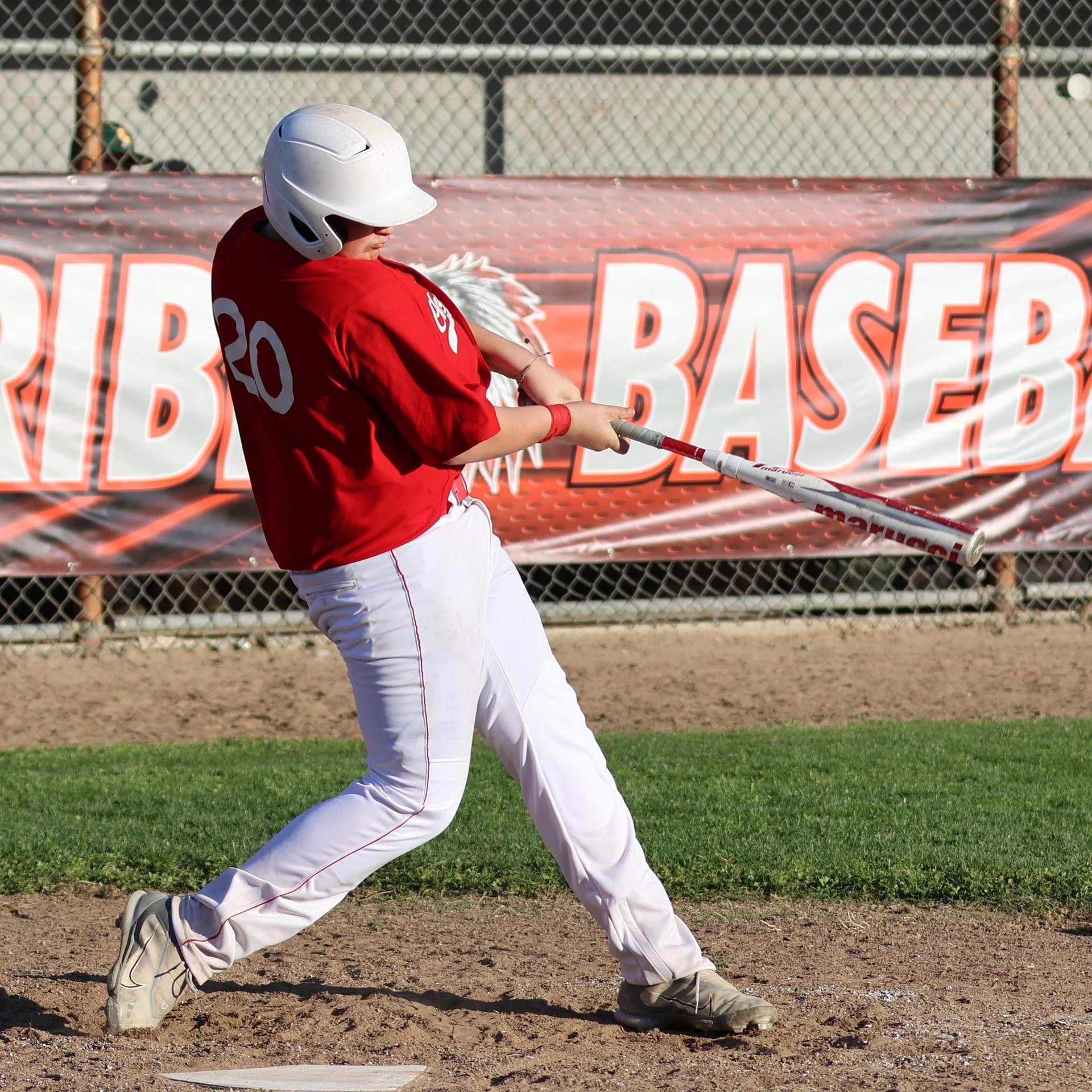 junior varsity baseball players in action