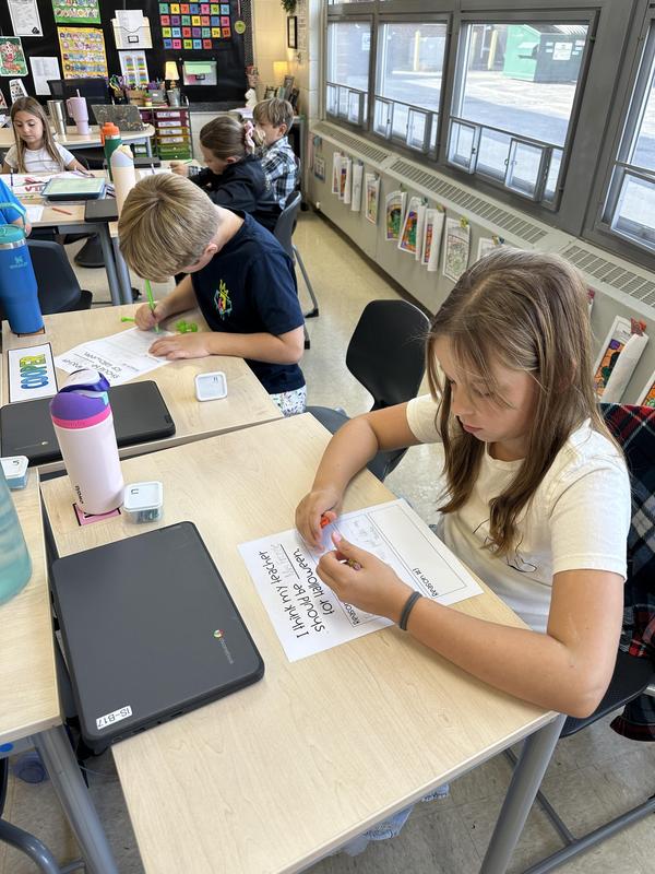 Students apply author’s claim to state position on teacher’s Halloween costume