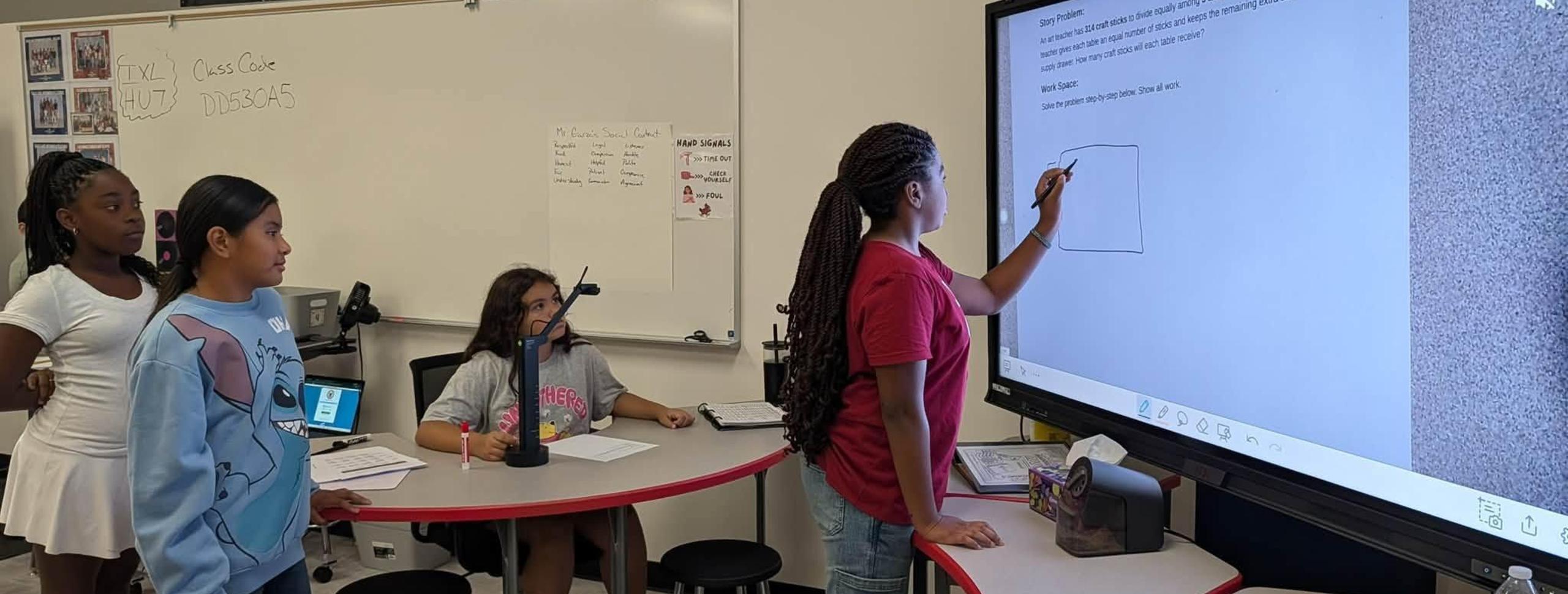 kids writing on board