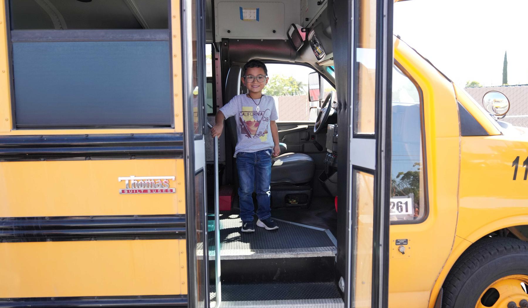student exiting a school bus