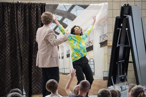Actors from Bright Star Theatre celebrate the end of their show with Lee students.