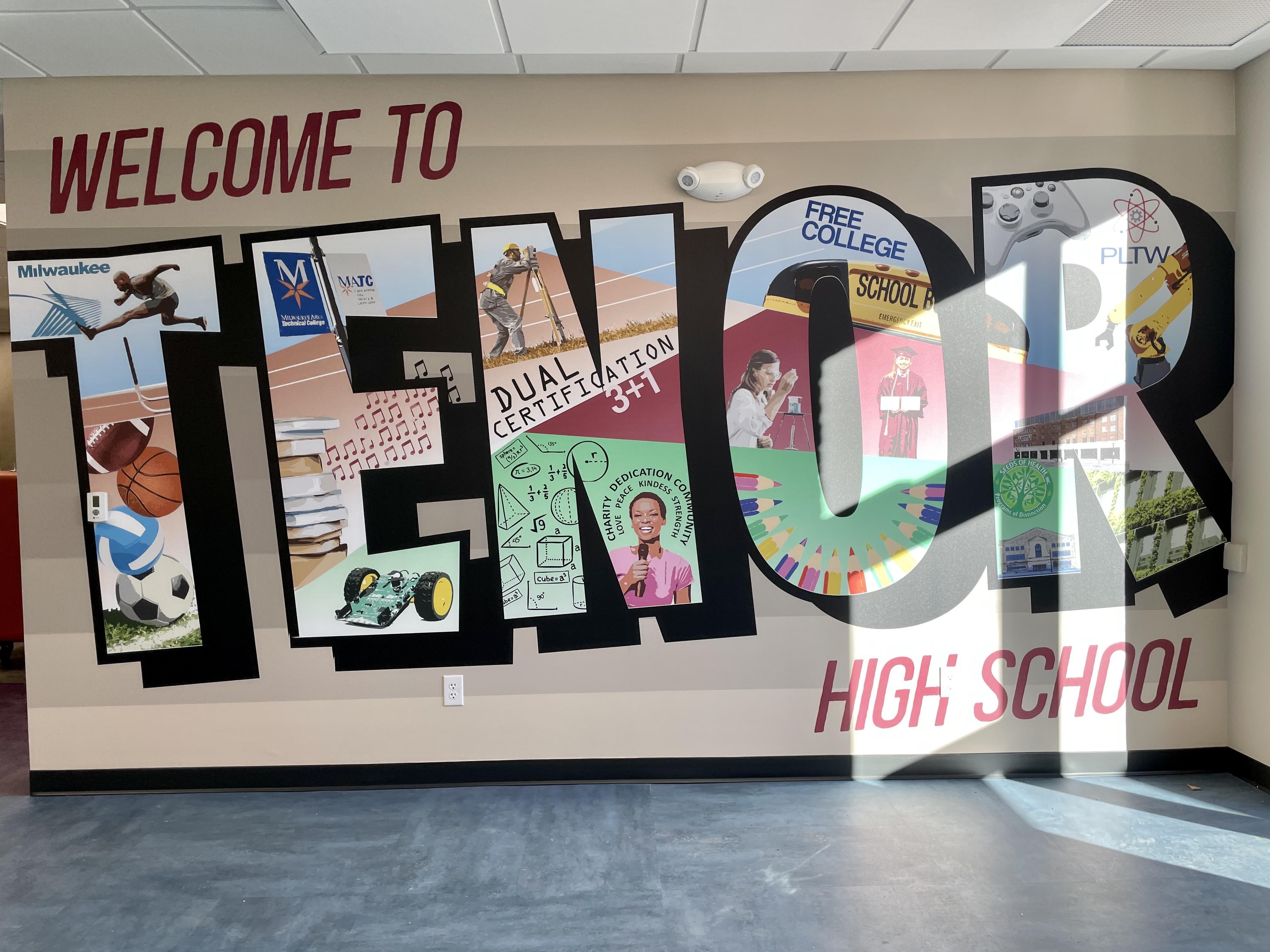 A mural with clipart designs inside large letters that read 