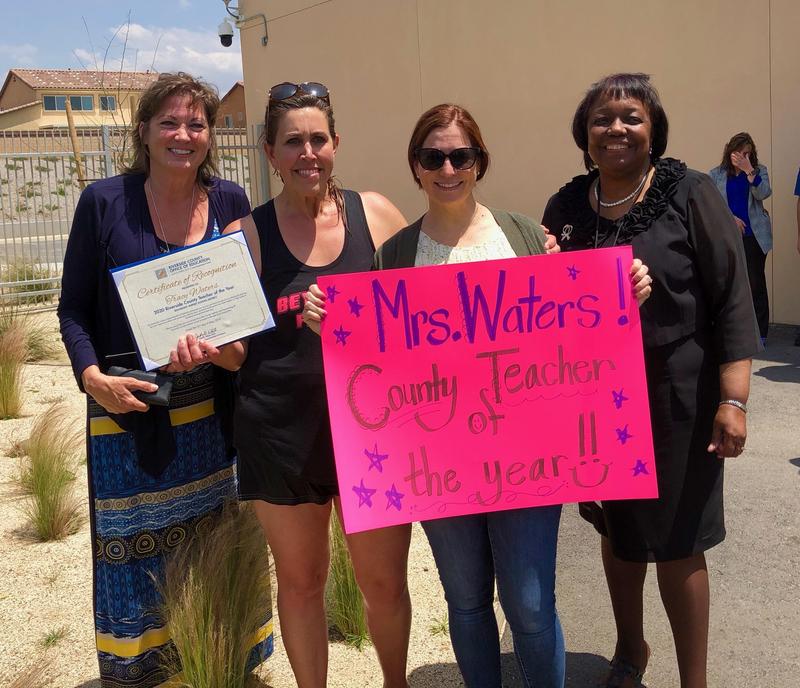 Tracy Waters, Lauren Kinney, Dr, Judy White, and Starlight Staff holding congratulatory sign