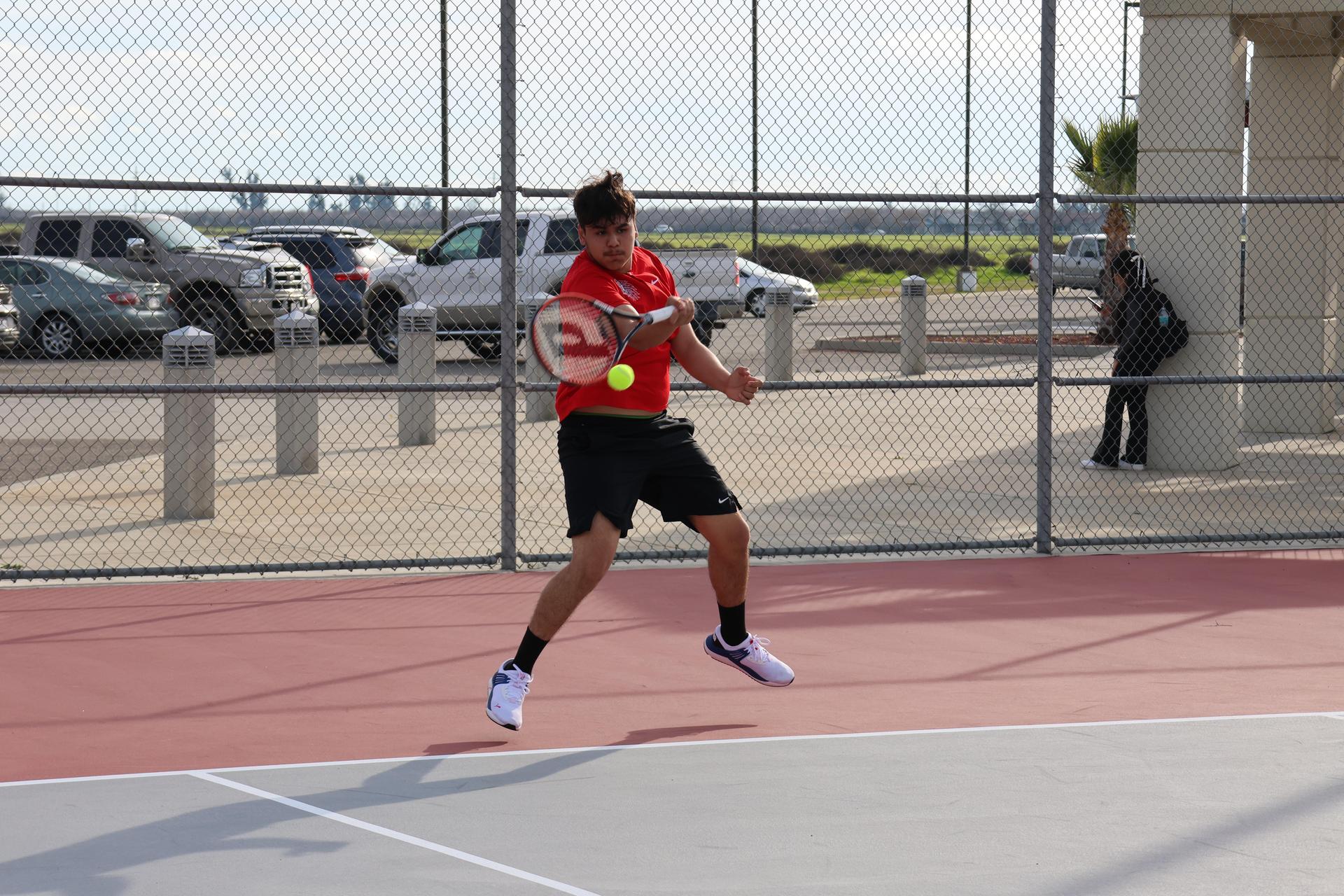 CUHS Boys playing tennis against coalinga