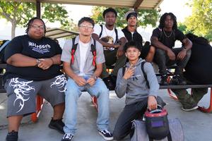 Group of boys sitting at a picnic table