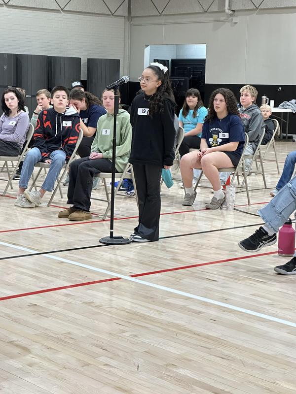 Students competing at spelling bee