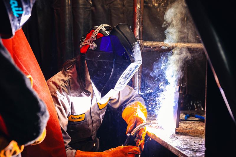 student welding in lab