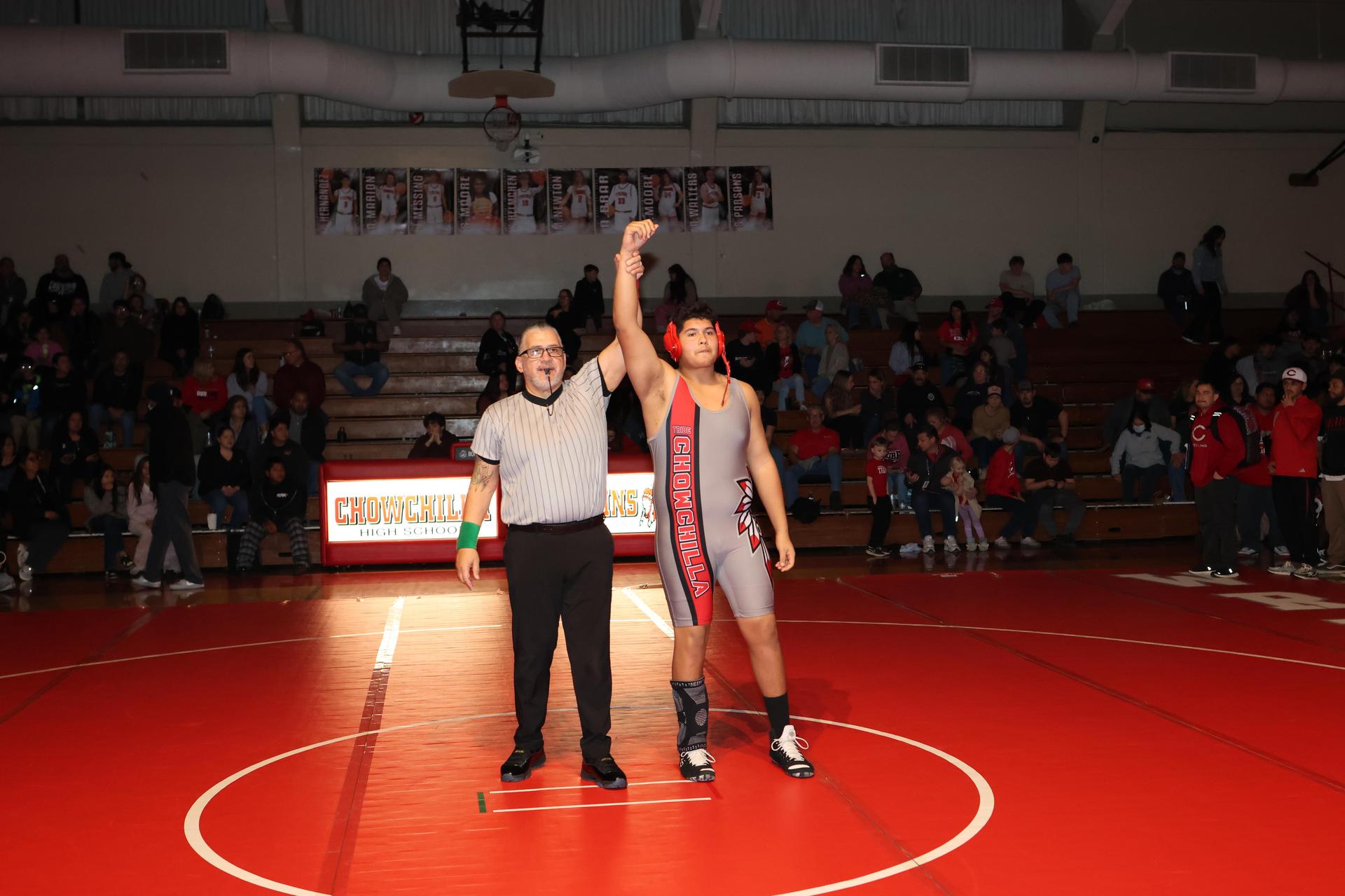 Wrestling winners with hands up 42