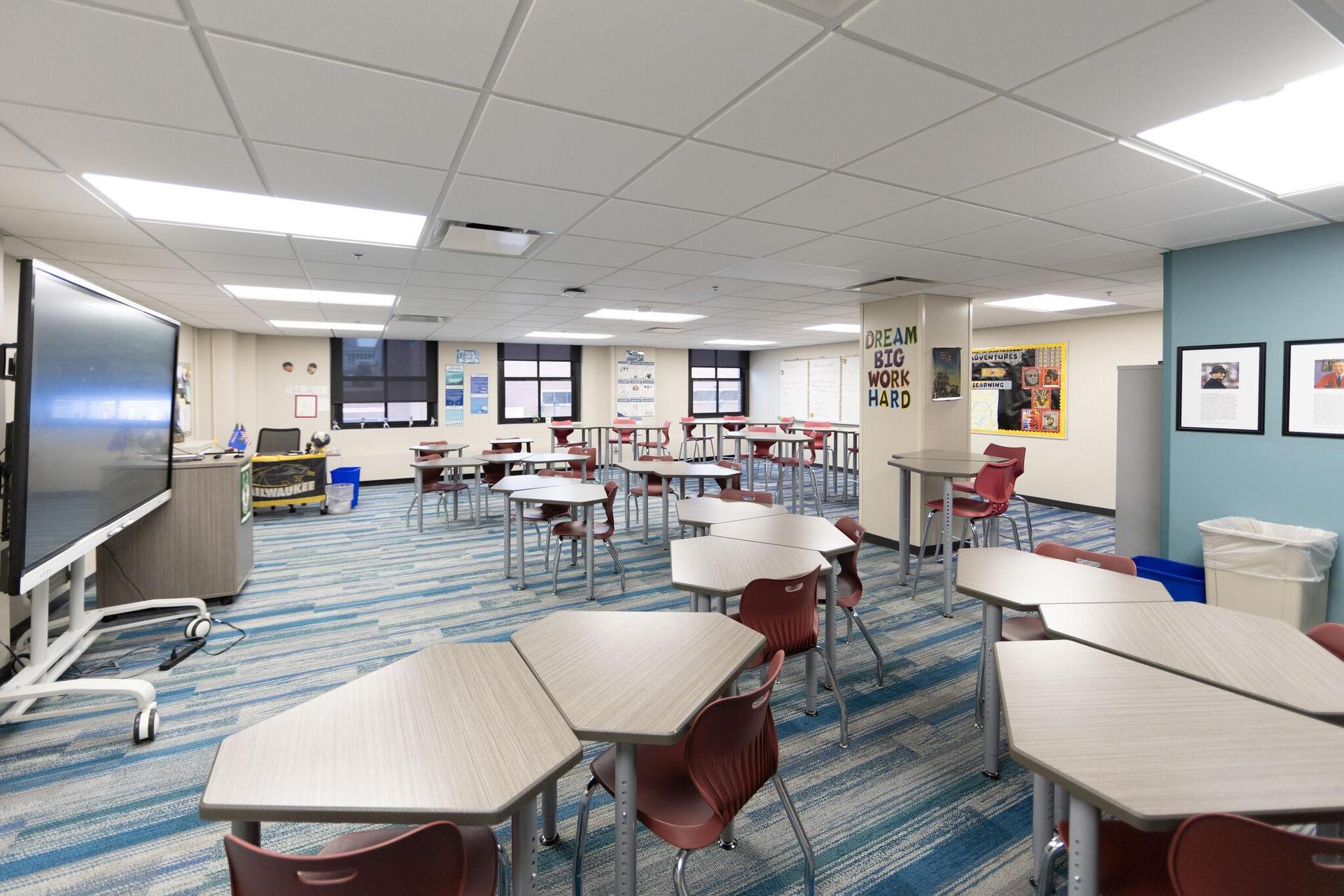 A newly renovated classroom. It has new carpetng, desks, chairs, and is located in a new section of the school.