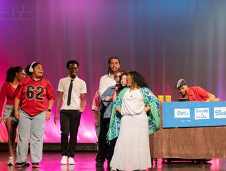 Students performing on stage