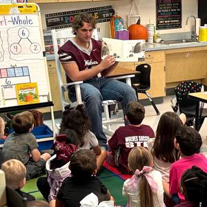 Davenport High School Brody Vestal reading to elementary students