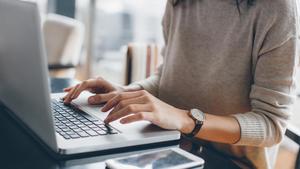 Typing on a laptop