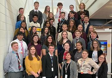 Business Professionals of America students pose in the school stairway.