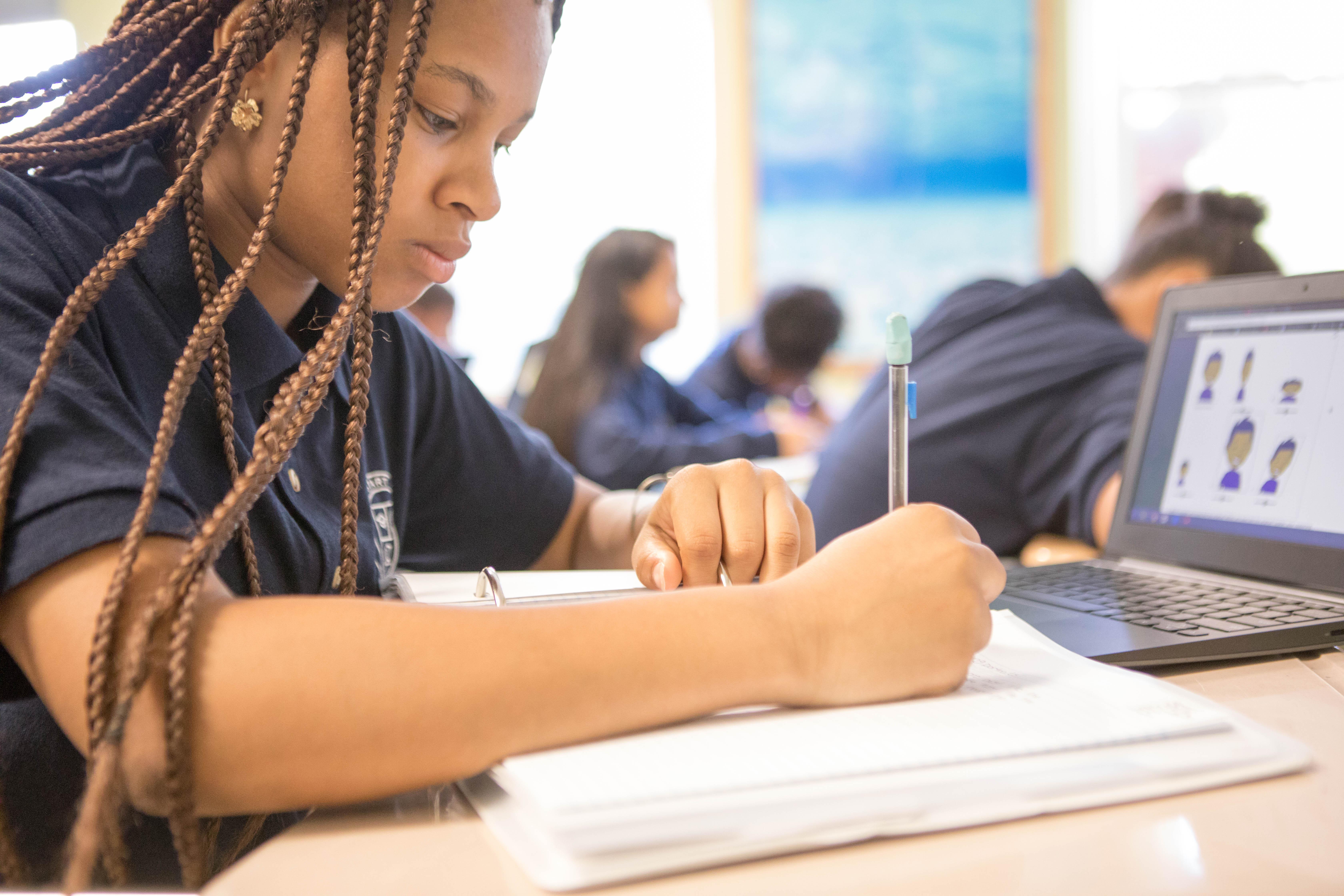 Scholars at work, writing and reading.