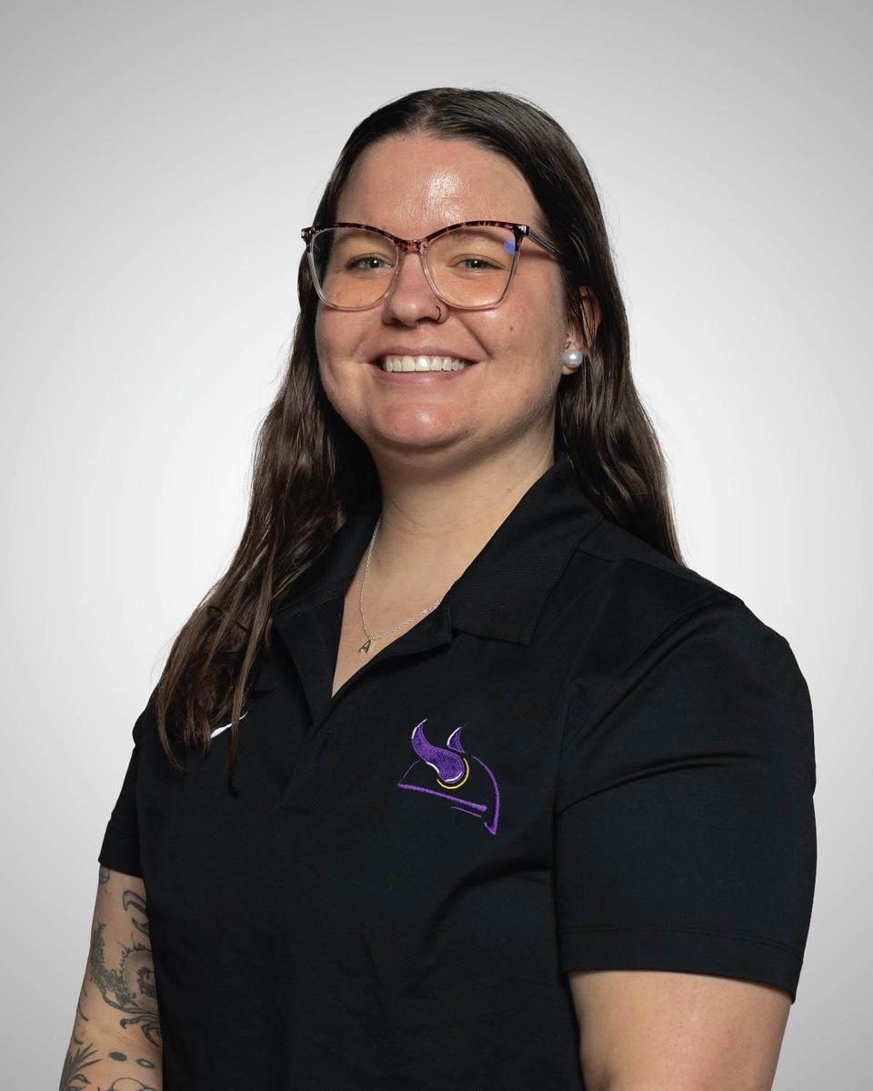 Lady Vikings Head Coach posing for the roster