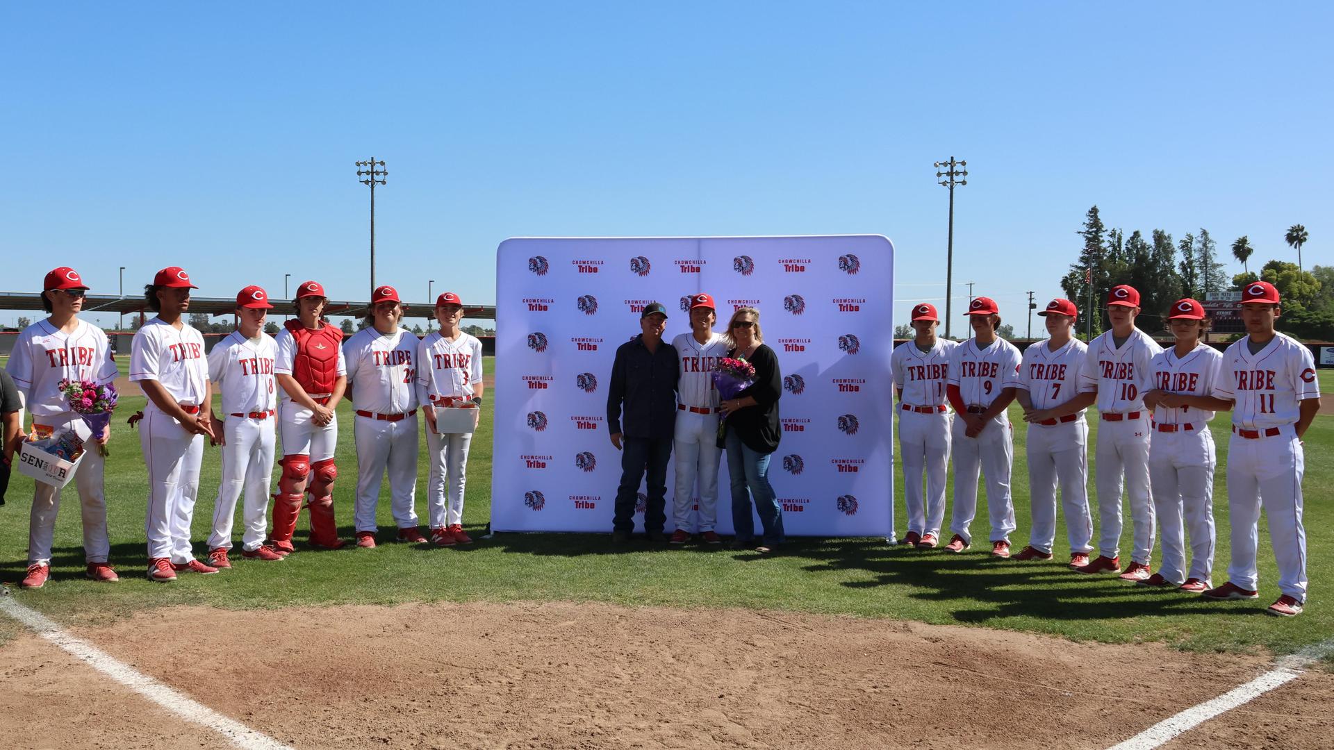 Seniors Posing With Teammates, Coaches, And Family