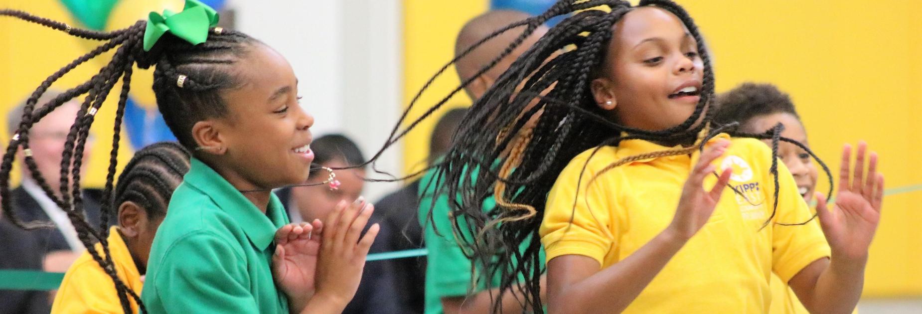Two KECP girls dancing in the gym