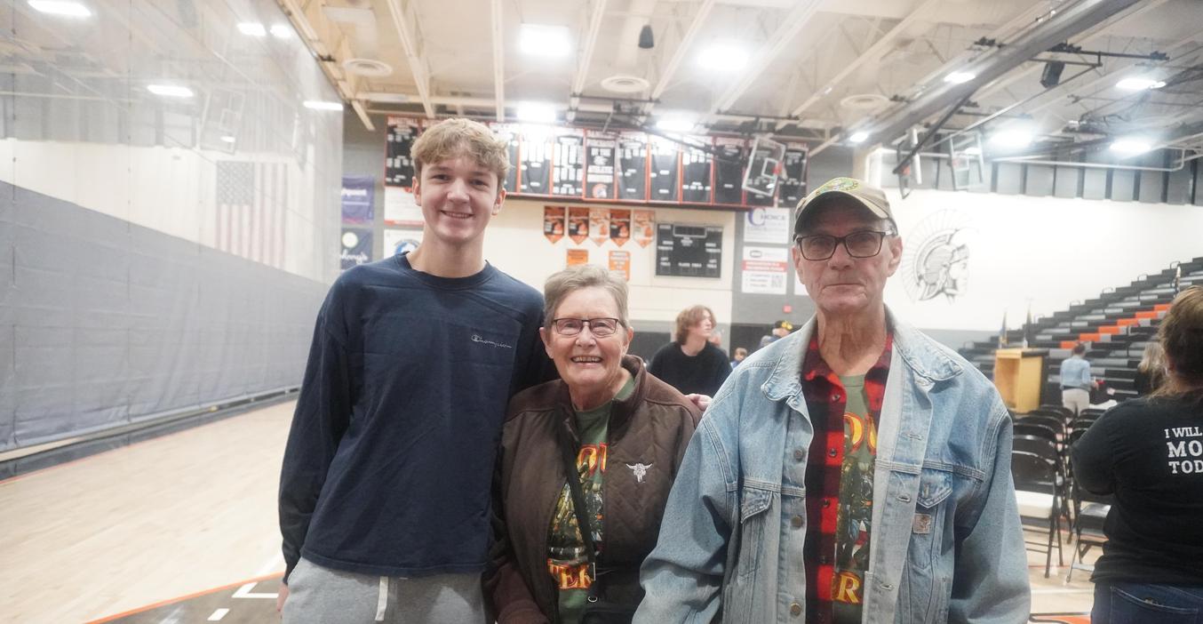 A TKHS student welcomes relatives to the annual Veterans Day program.