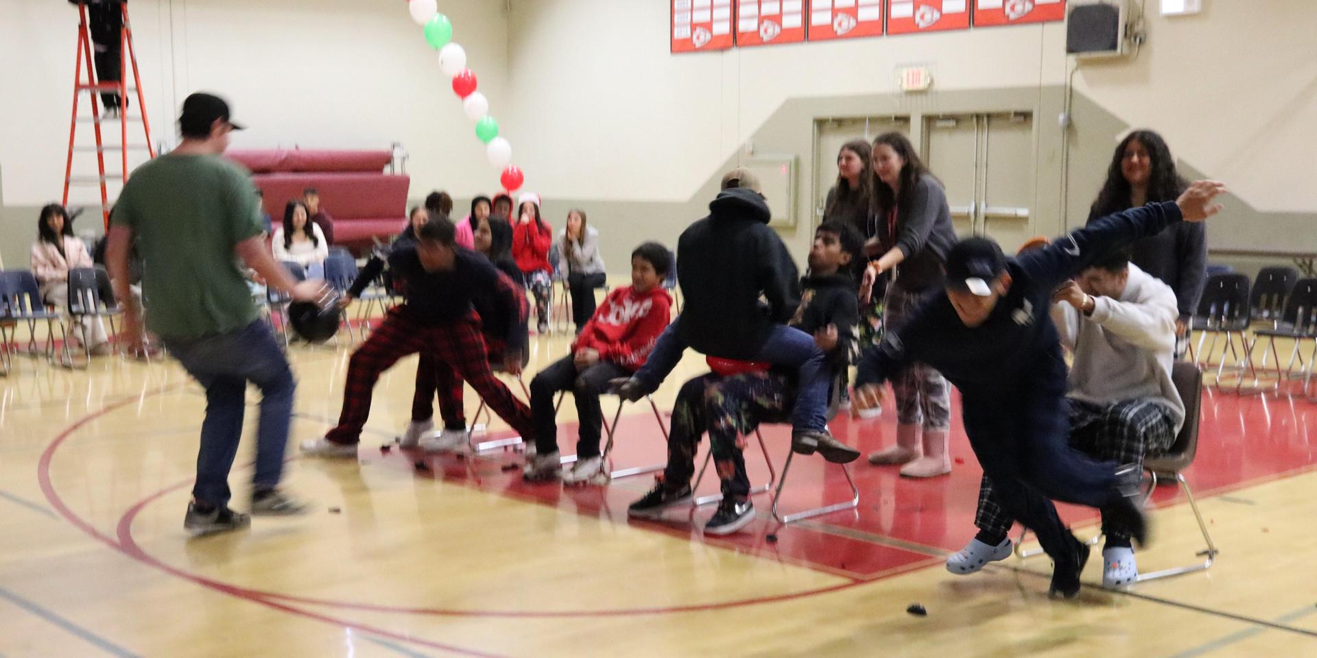 students playing the balloon pop game