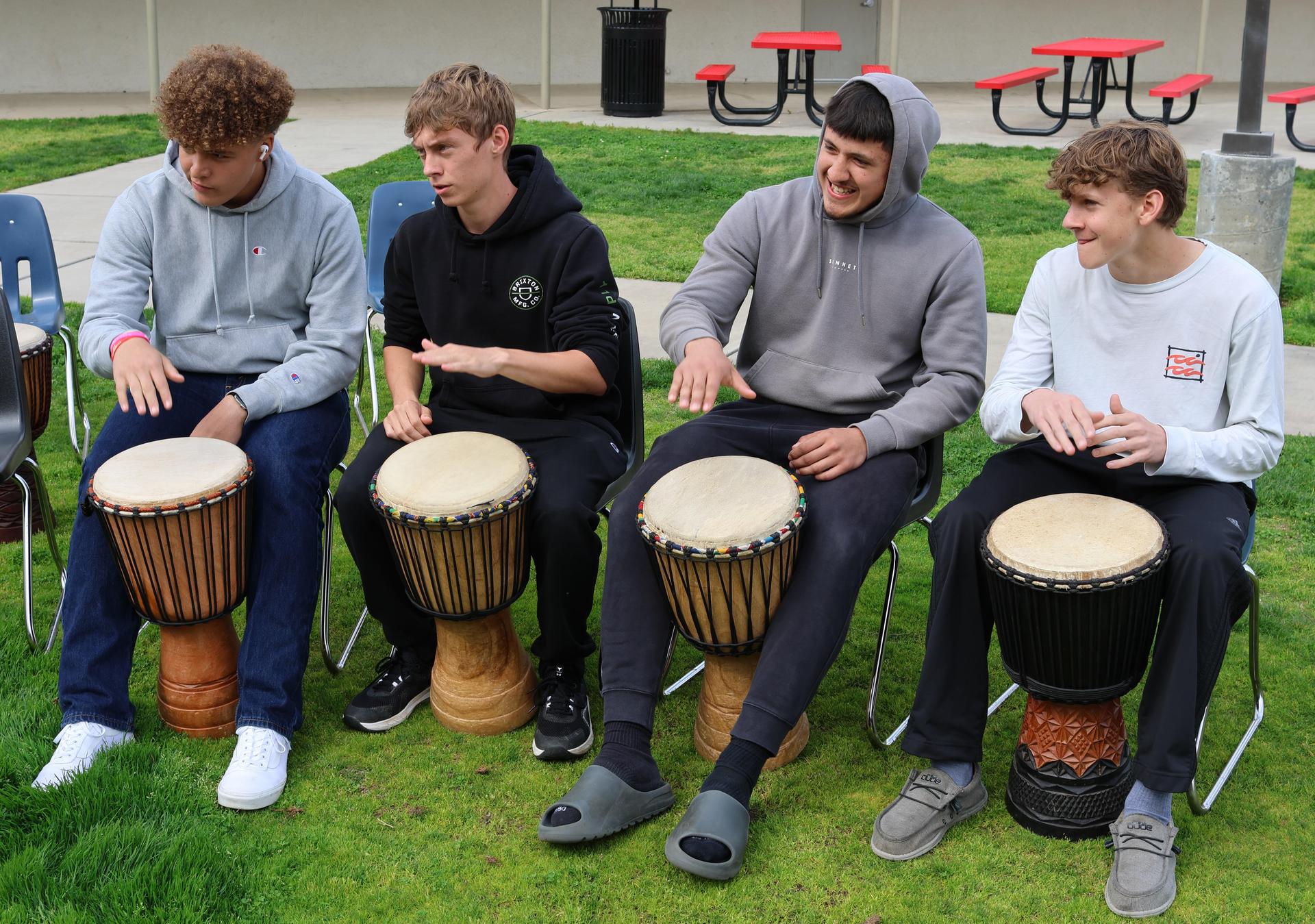 students and staff participating with the African Drum Interactive