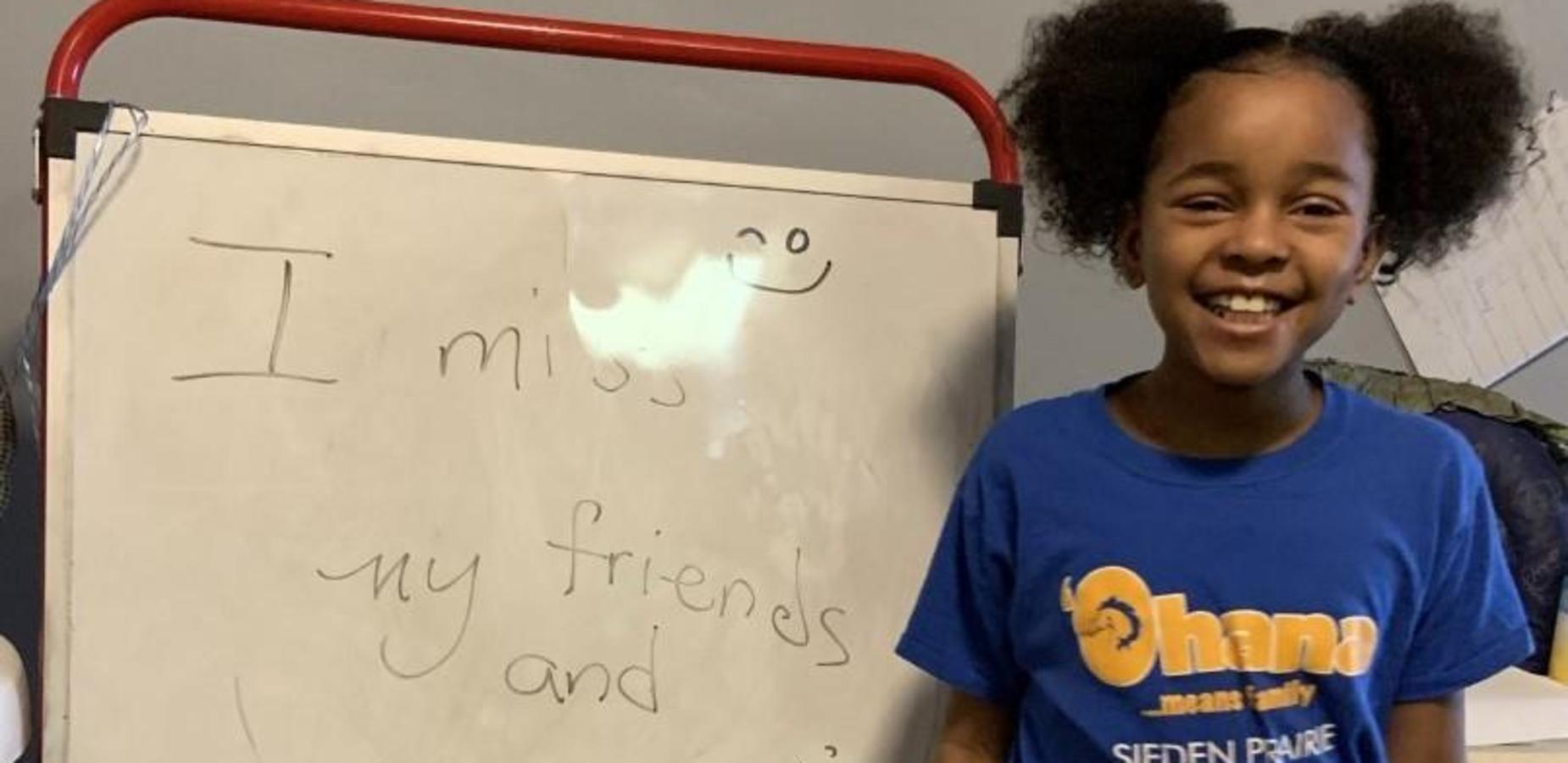 Student Standing Near Whiteboard