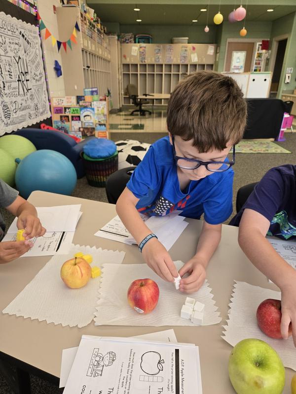 Students help find the prized apple