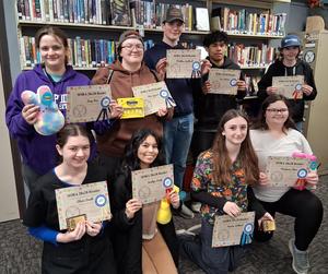 Students who completed Sora Reading Challenge gather in FCTS Library