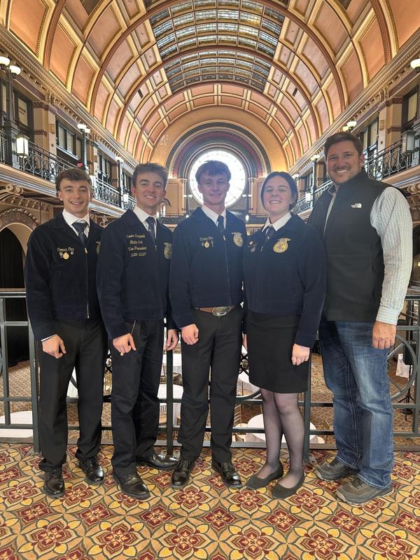 FFA Students and coach smiling for group photo
