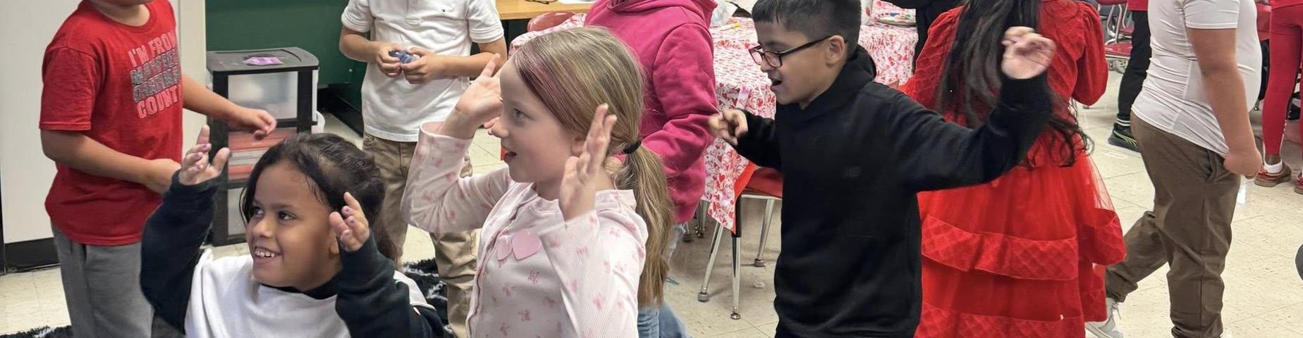 Students playing at the Valentines Day party.