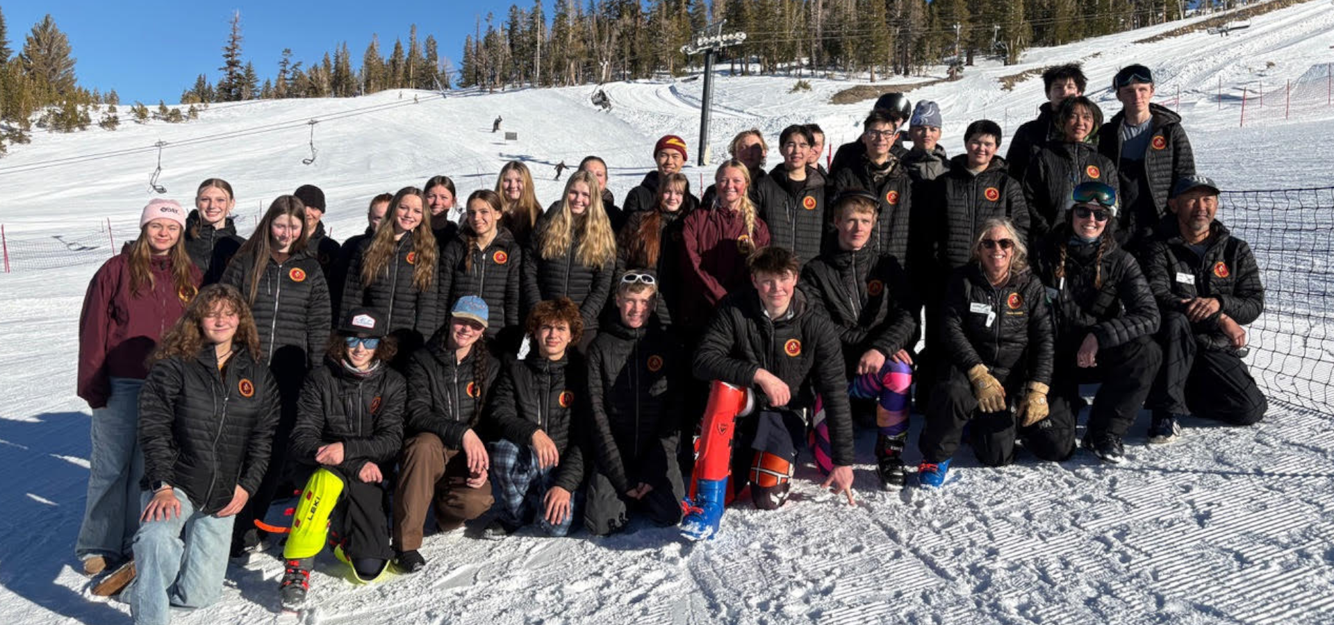 Mammoth High School Ski and Snowboard team photo on the snow