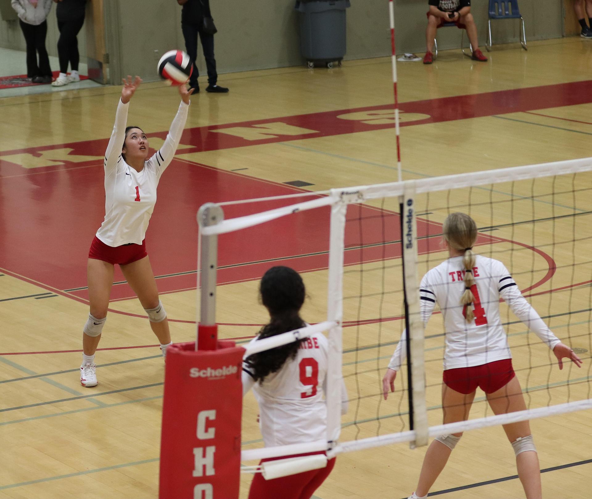 varsity volleyball players in action against Minarets