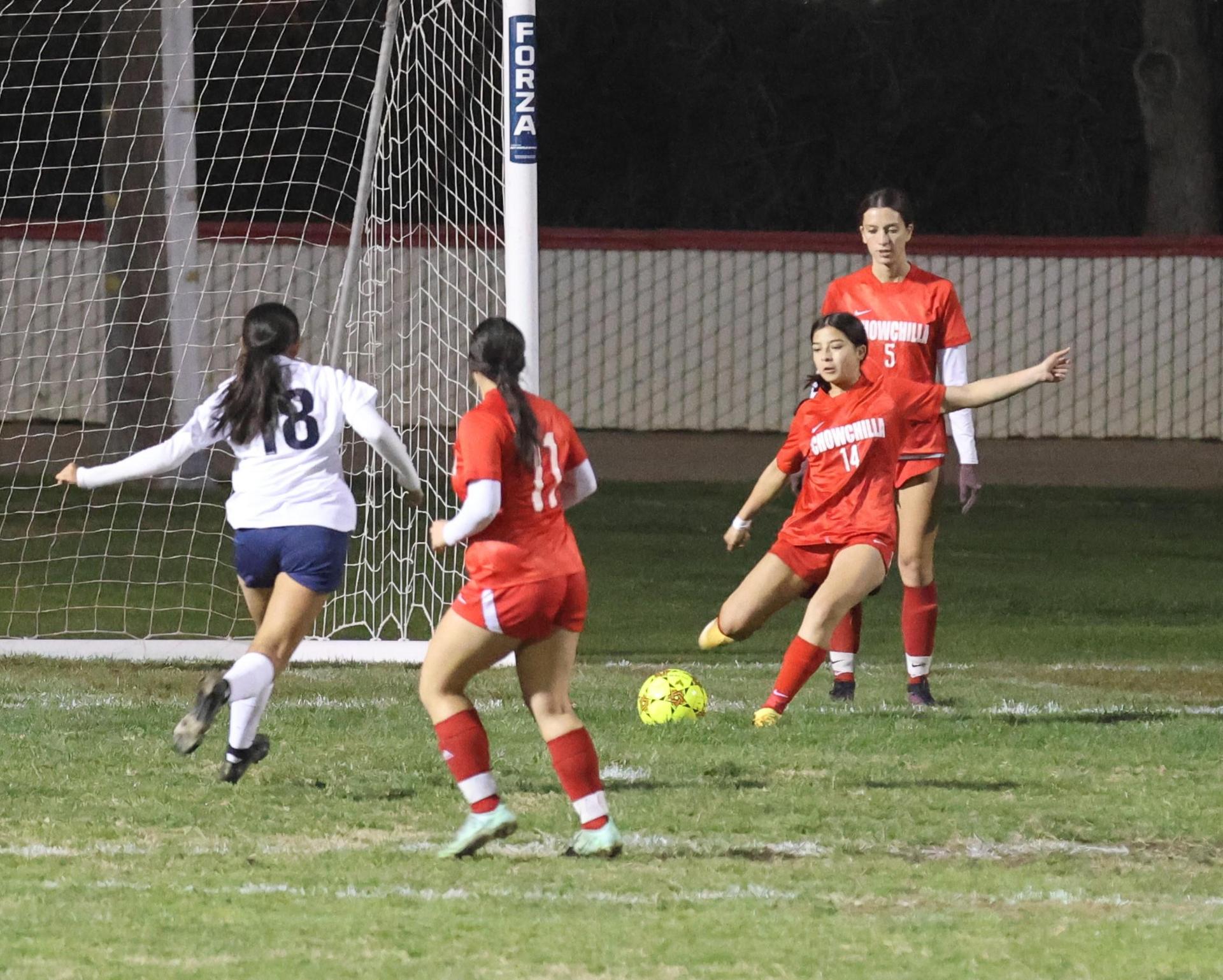 Varsity girls playing soccer against sunnyside