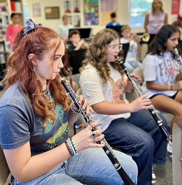 Middle School Band members rehearse for the concert.