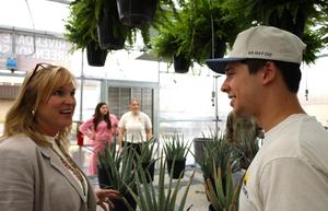 Student and principal in the greenhouse