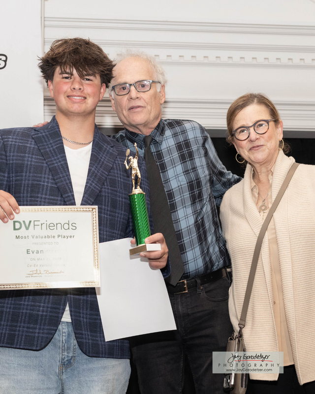 Student Receiving award from Coach