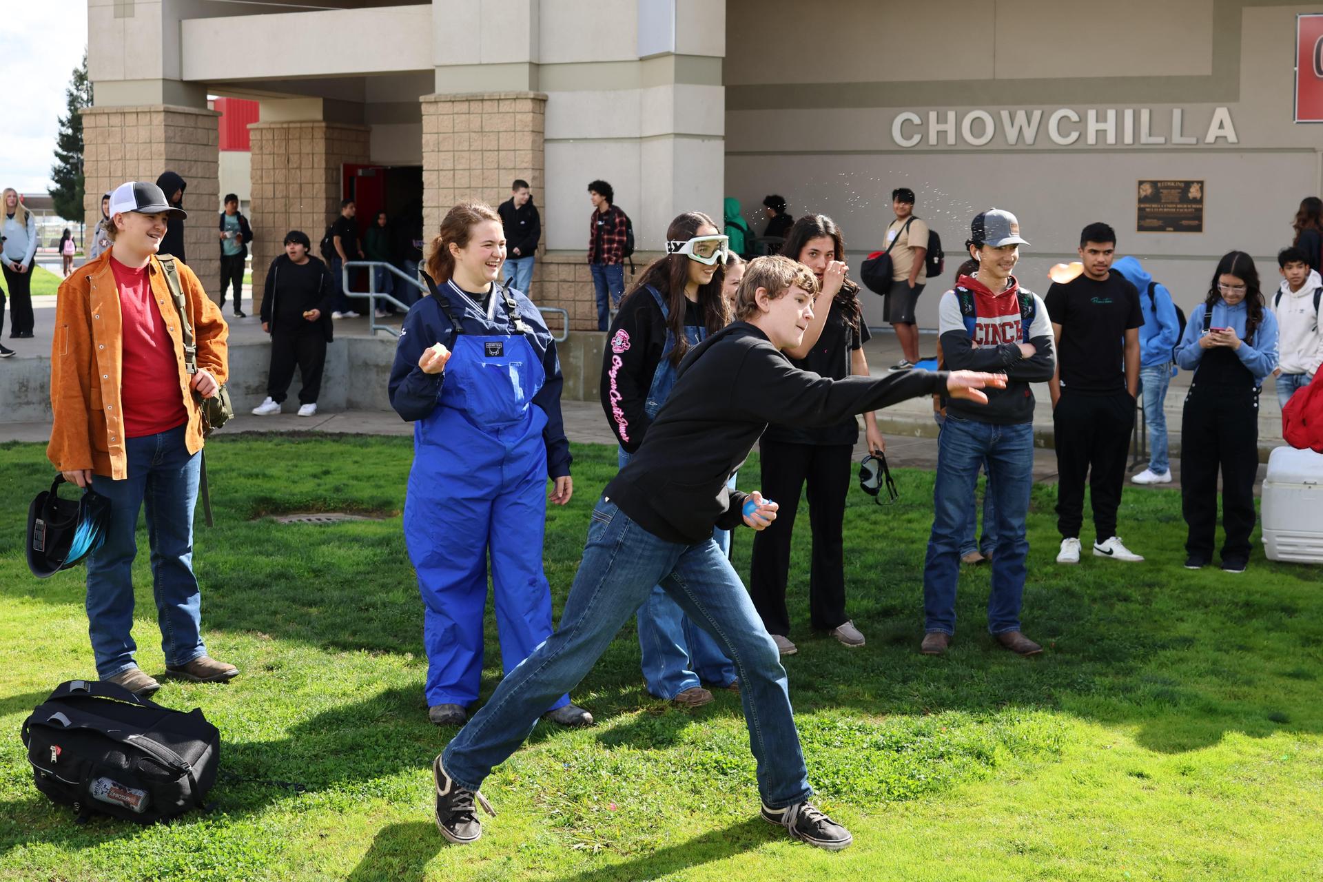 students and staff enjoying the water balloon toss