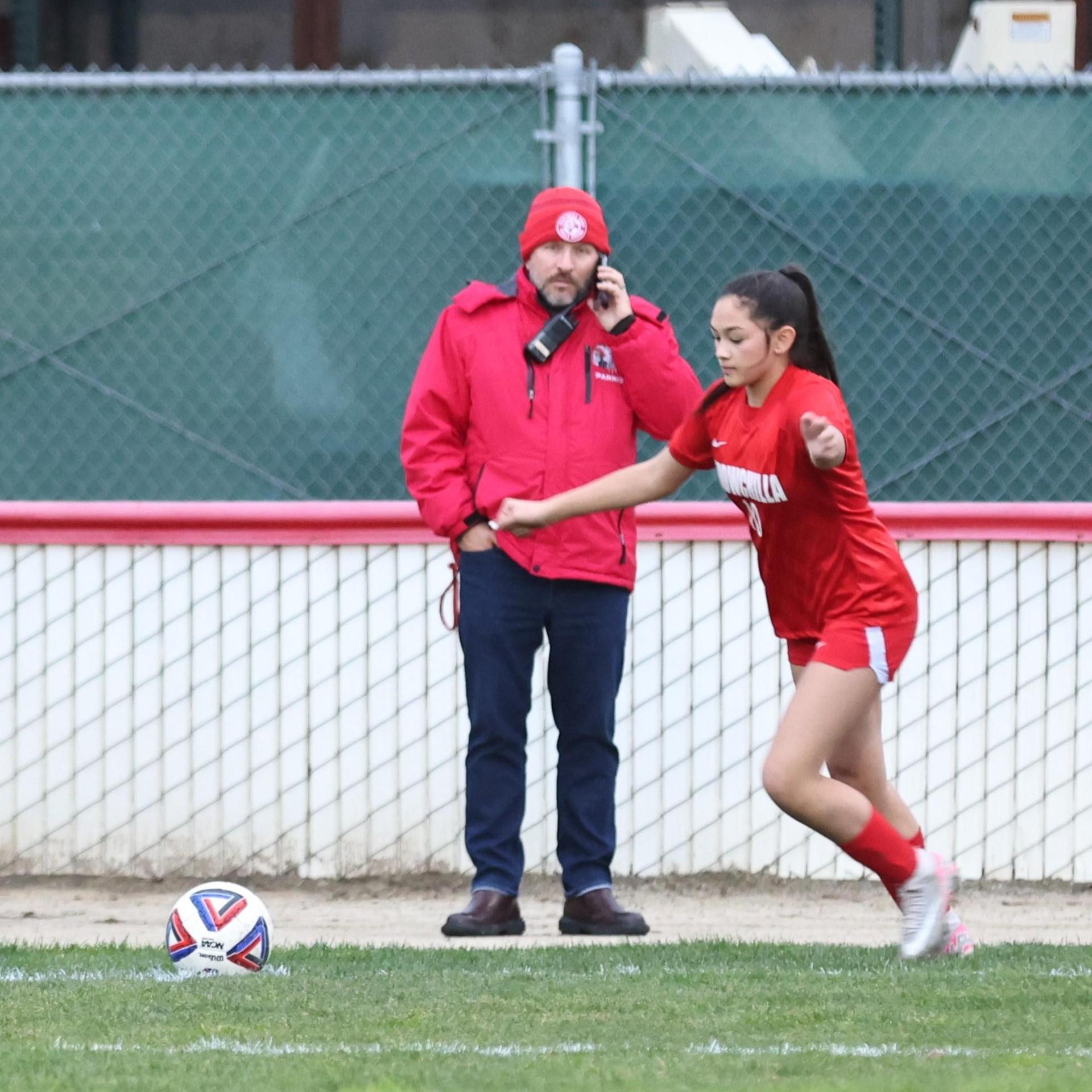 Junior varsity girls playing soccer against liberty