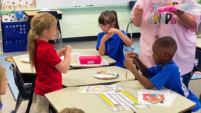 Southeast Elementary Students Participating in a Bracelet Project in Class