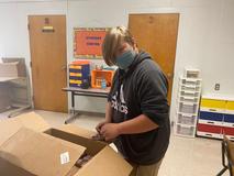 Students working on Christmas door decorations
