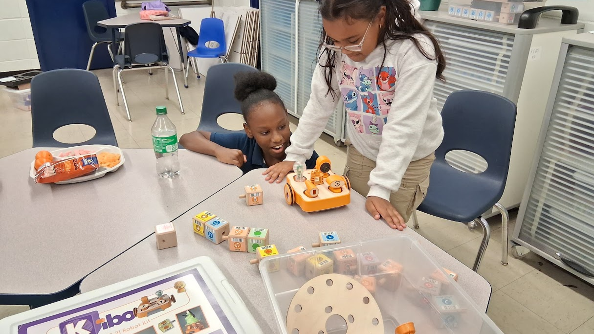 two kids working on robotics