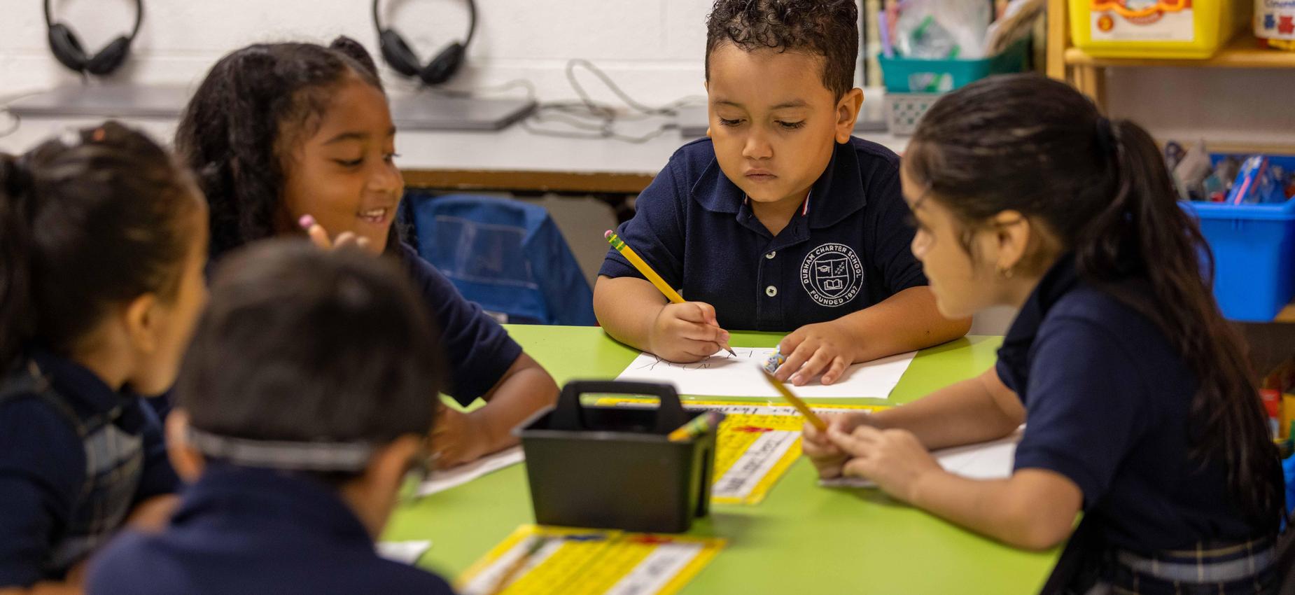 Scholars at work, writing and reading.