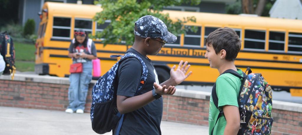 Two boys talking before classes.
