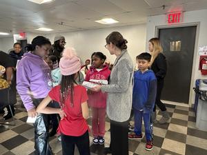 students working with the seniors at the center