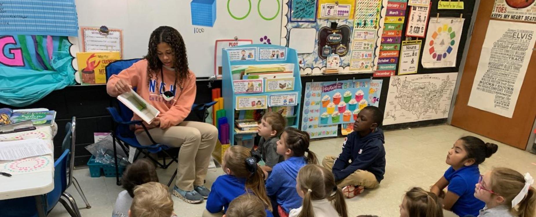 Kindergarteners and a guest reader photo