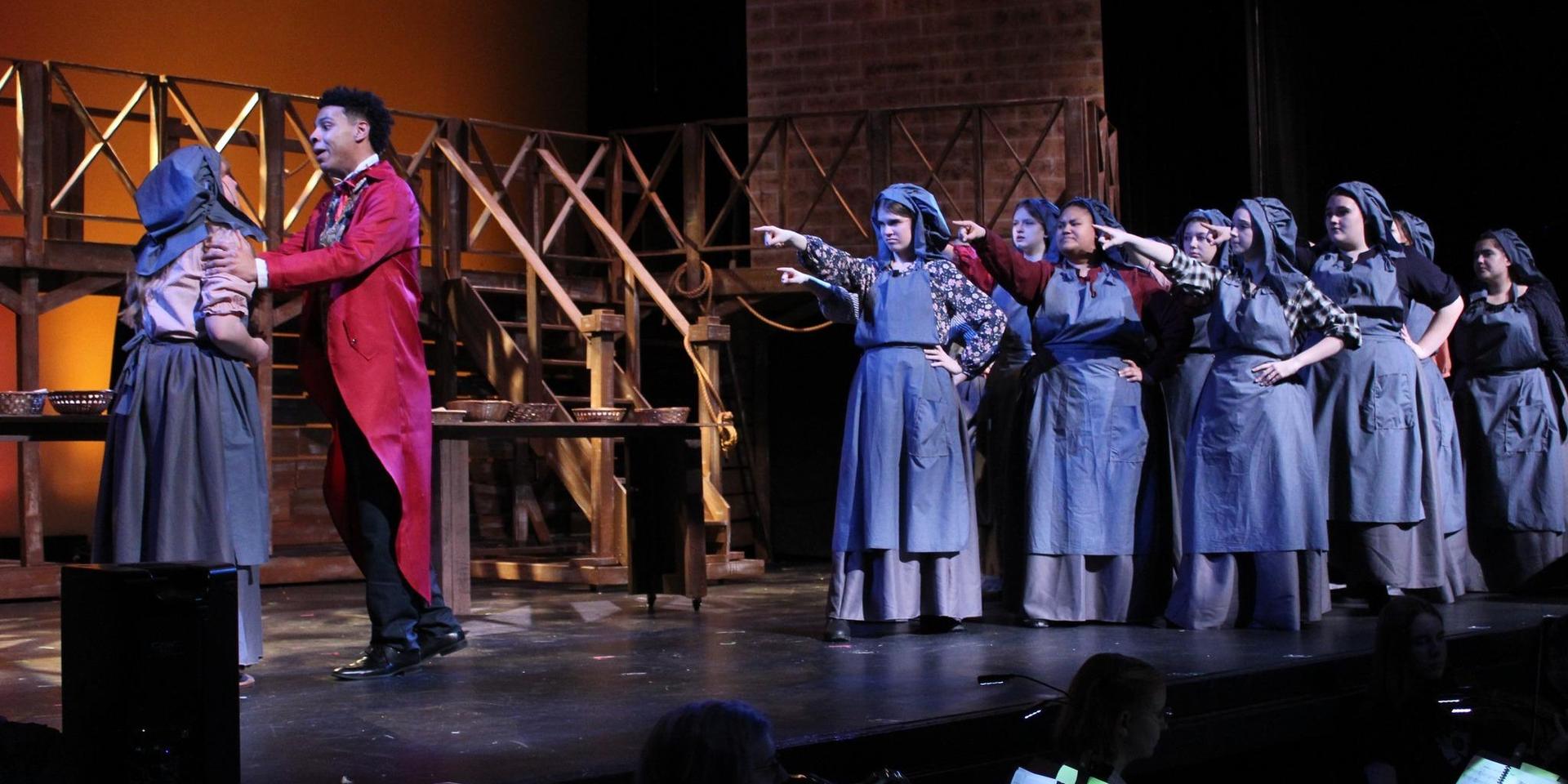 Youth Theater presents Les Mis on stage in costumes