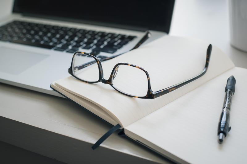 Laptop, Glasses and Notebook