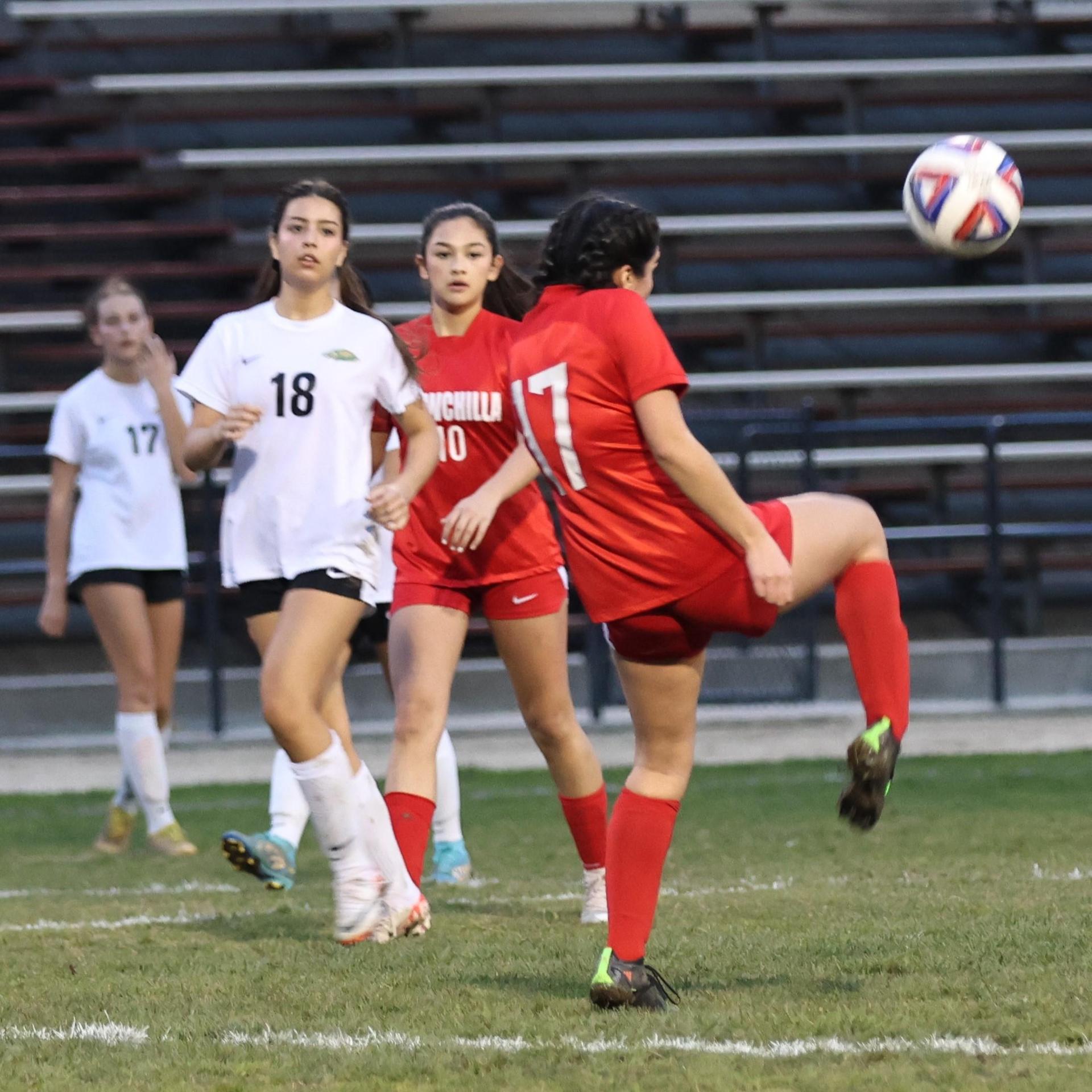 Junior varsity girls playing soccer against liberty