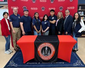 a cool event with some teachers standing at a table